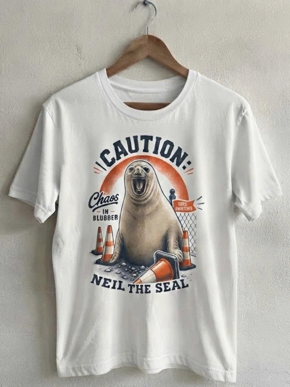 Caution Neil the Seal Graphic Tee - White with Orange & Black Print